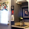 redecorated laundry room with chandelier, paint and pictures