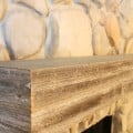 Installing a wood mantel on a stone wall