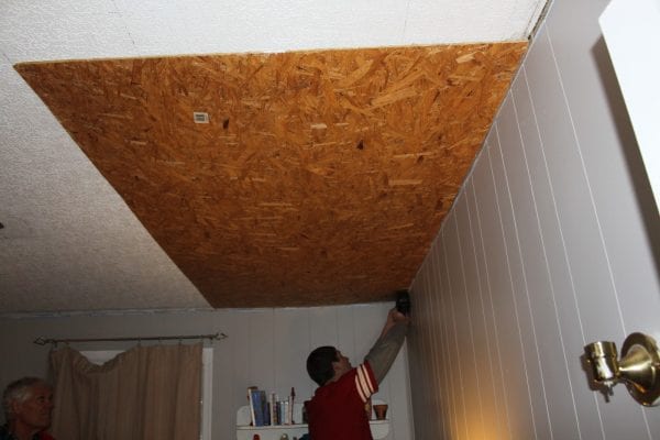 Rustic Pallet Ceiling Tutorial by Maple Leaves and Sycamore Trees featured on Remodelaholic