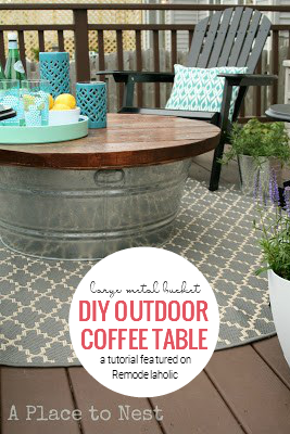 DIY Outdoor Coffee Table From A Large Metal Bucket By A Place To Nest Featured On Remodelaholic