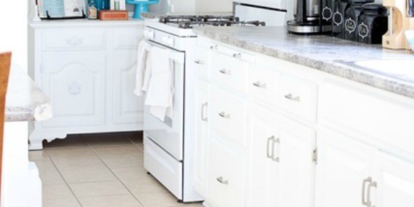 white kitchen remodel reusing old thrifted cabinets feature