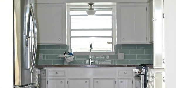 featured small white kitchen remodel, Fisherman's Wife Furniture featured on Remodelaholic.com