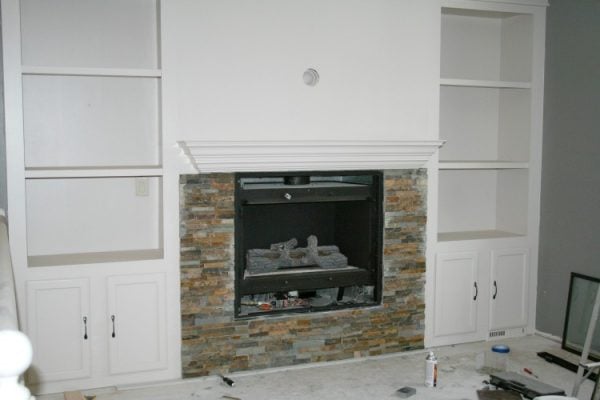 fireplace makeover with stone tiles and built-in shelves, construction2style on Remodelaholic