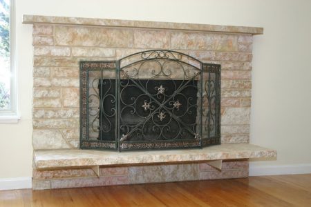restoring a painted stone fireplace, featured on Remodelaholic