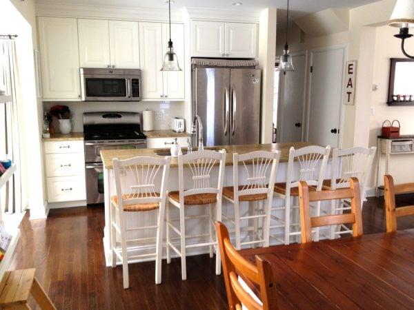 single wall kitchen layout with kitchen sink island via Remodelaholic.com