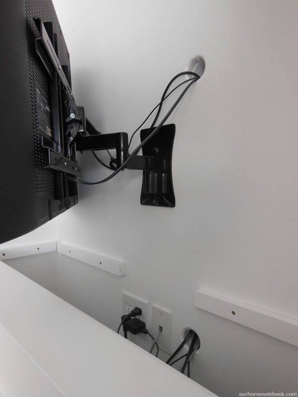 TV and Fireplace Built In that Hides the Cords by Our Home Notebook featured on Remodelaholic