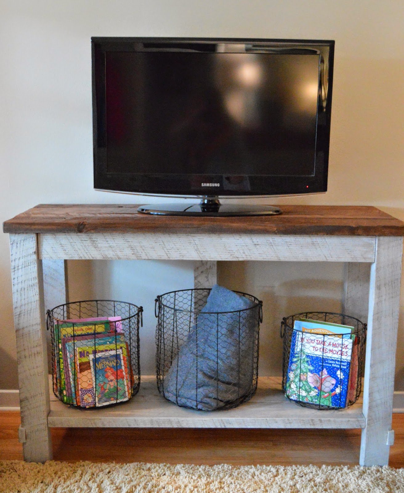 Remodelaholic 95 Ways To Hide Or Decorate Around The Tv Diy Reclaimed Wood Tv Table That Hides Electronics Cords Kruse S Work Via Tatertots And Jello