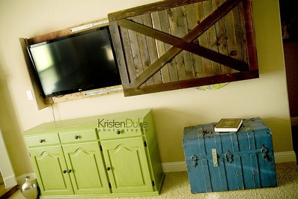 diy sliding barn door cover to hide the television (Kristen Duke Photography)