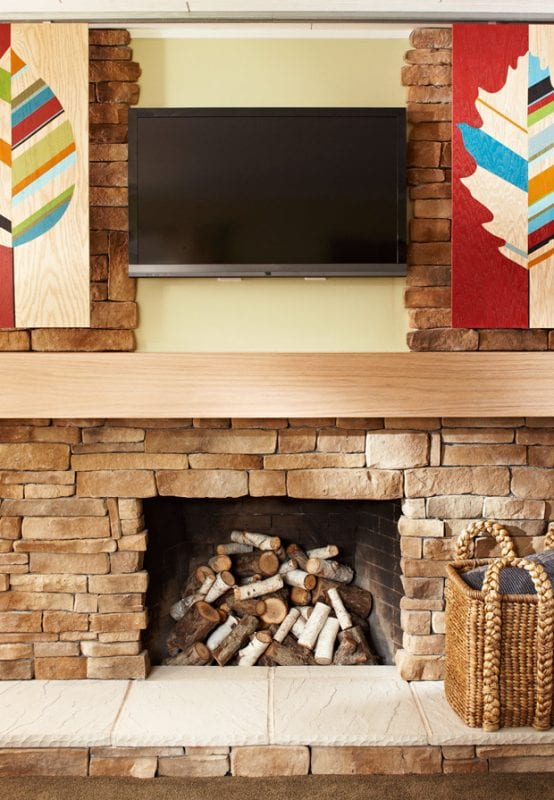 sliding artwork to hide television, using inexpensive closet slides (Lowe's Creative Ideas)