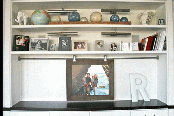 sliding photo frame to cover TV in shelf (Mary Romney via Color Issue)