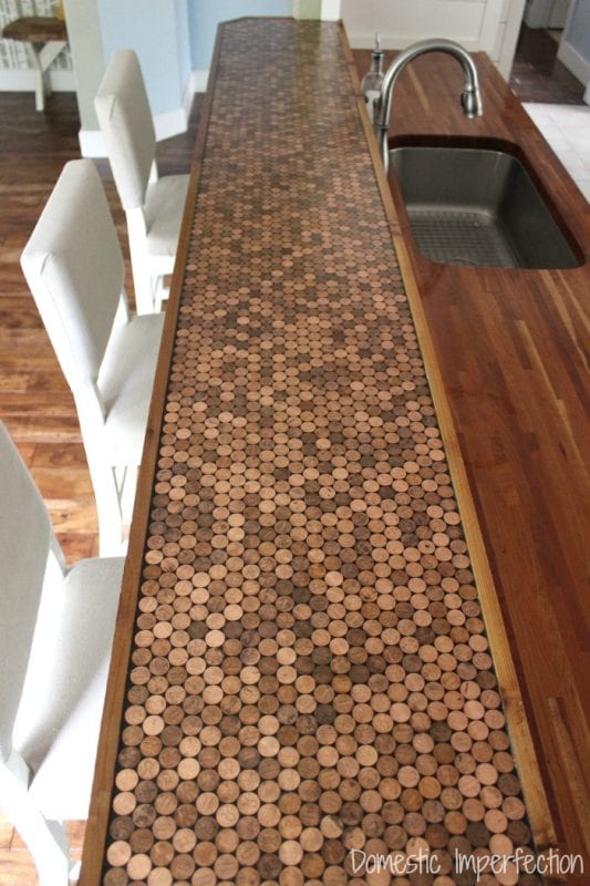 DIY penny countertop, with a durable epoxy sealant and a wood edge