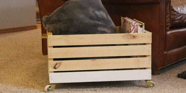 A beautiful multi-purpose display box with gold accents that's ideal for magazines, blankets, and toys!
