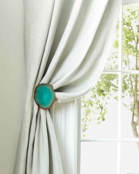 agate coasters on metal tiebacks white curtains