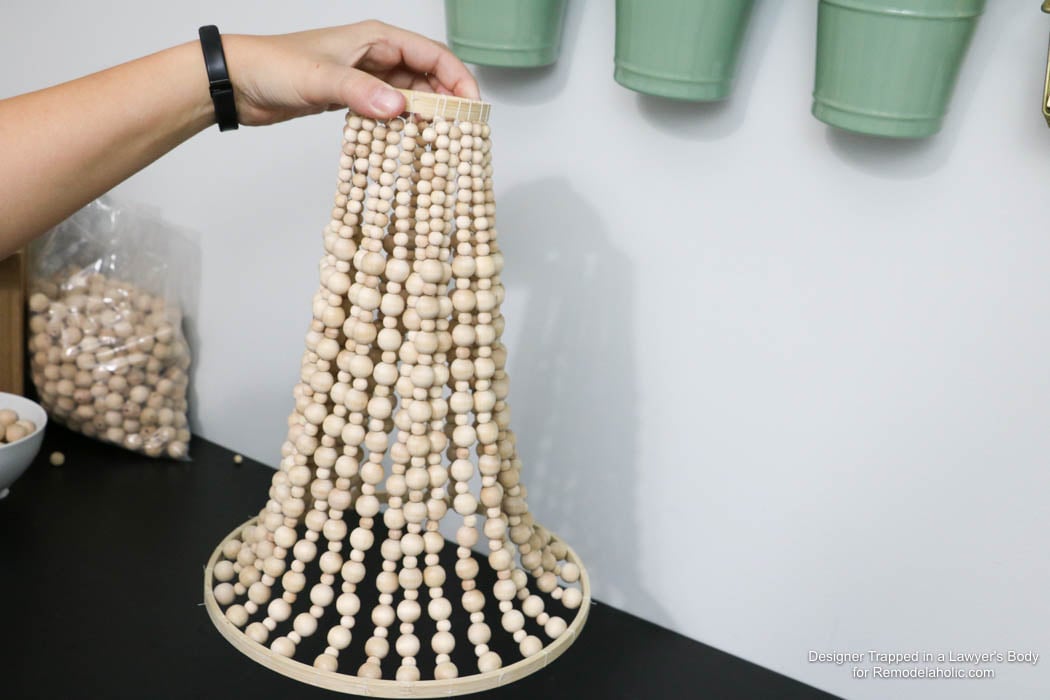 WOW! Come learn how to make your own wood bead chandelier with this awesome tutorial by Designer Trapped in a Lawyer's Body for Remodelaholic.com!