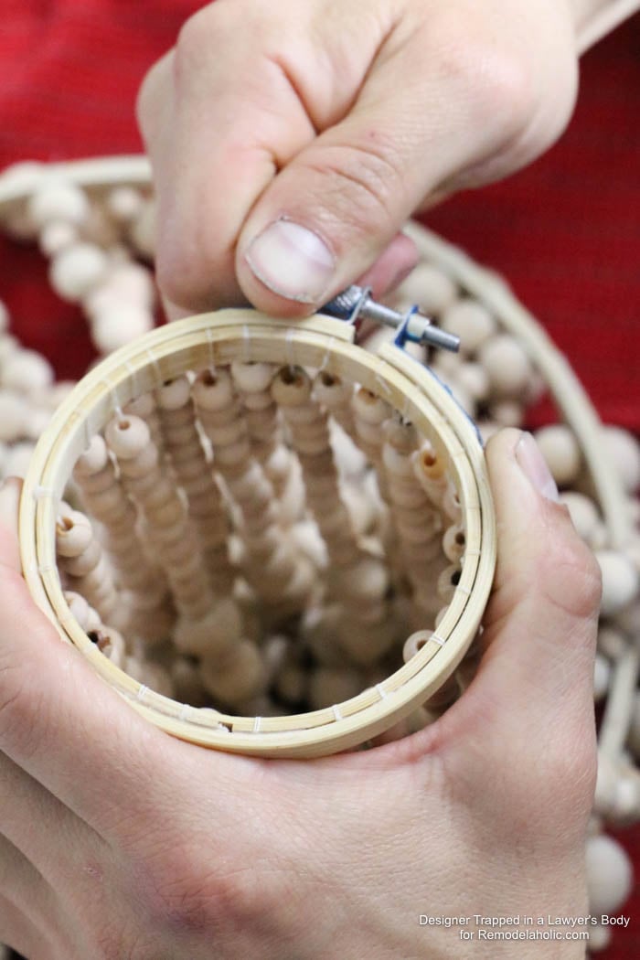 WOW! Come learn how to make your own wood bead chandelier with this awesome tutorial by Designer Trapped in a Lawyer's Body for Remodelaholic.com!