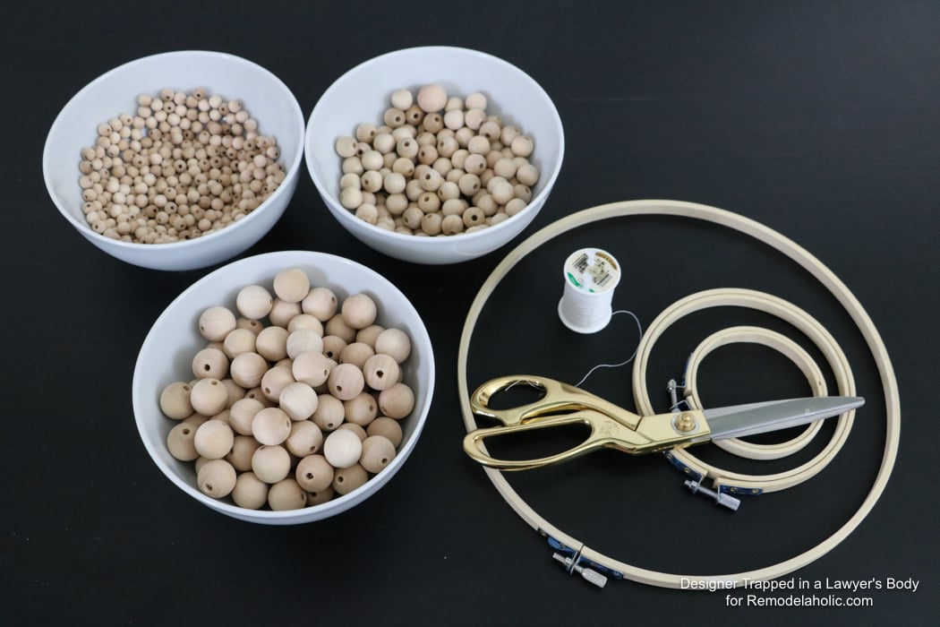 WOW! Come learn how to make your own wood bead chandelier with this awesome tutorial by Designer Trapped in a Lawyer's Body for Remodelaholic.com!