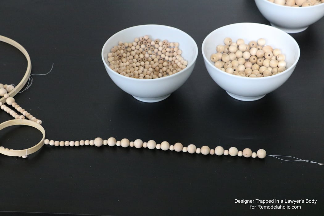 WOW! Come learn how to make your own wood bead chandelier with this awesome tutorial by Designer Trapped in a Lawyer's Body for Remodelaholic.com!