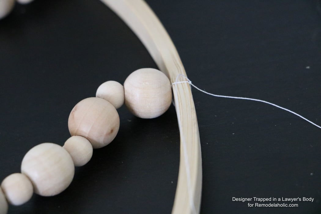 WOW! Come learn how to make your own wood bead chandelier with this awesome tutorial by Designer Trapped in a Lawyer's Body for Remodelaholic.com!