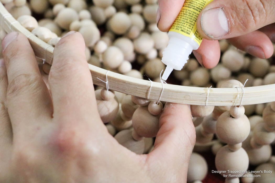 WOW! Come learn how to make your own wood bead chandelier with this awesome tutorial by Designer Trapped in a Lawyer's Body for Remodelaholic.com!