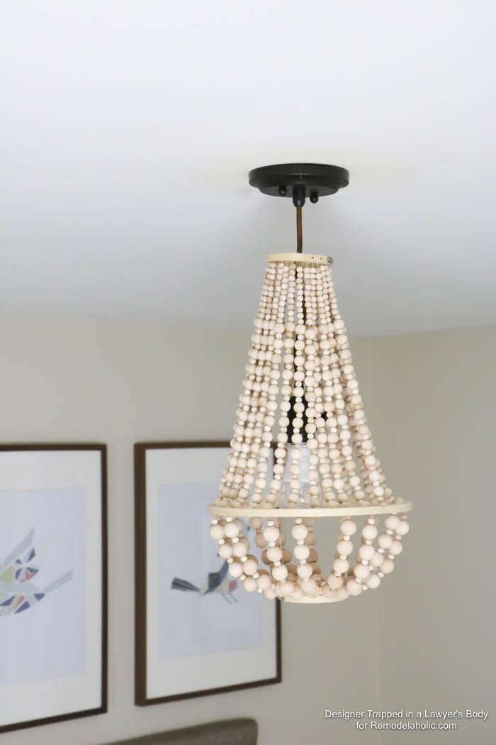 WOW! Come learn how to make your own wood bead chandelier with this awesome tutorial by Designer Trapped in a Lawyer's Body for Remodelaholic.com!