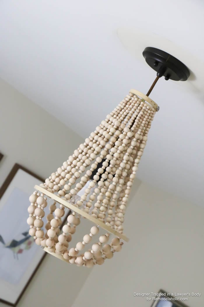WOW! Come learn how to make your own wood bead chandelier with this awesome tutorial by Designer Trapped in a Lawyer's Body for Remodelaholic.com!