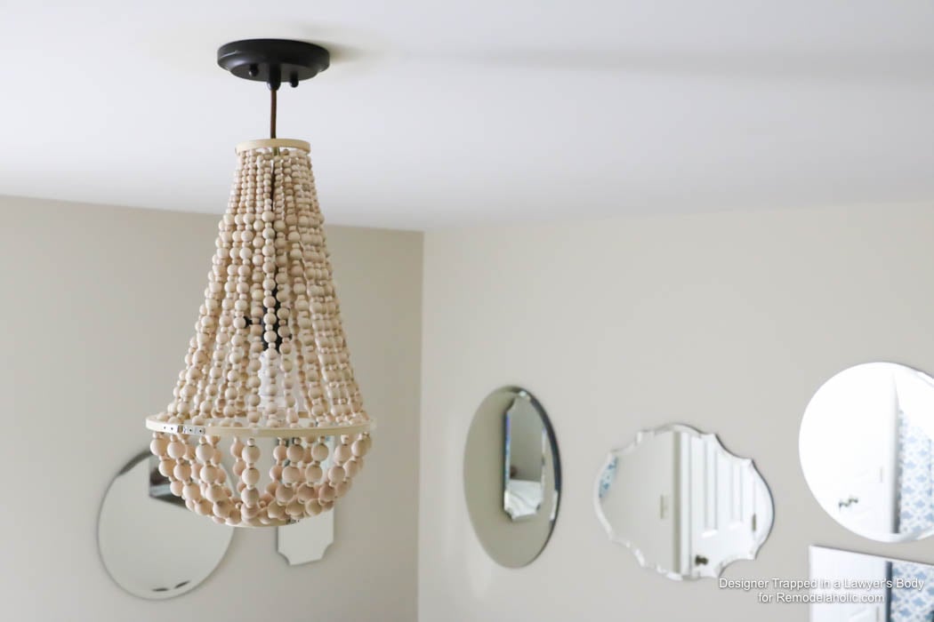 WOW! Come learn how to make your own wood bead chandelier with this awesome tutorial by Designer Trapped in a Lawyer's Body for Remodelaholic.com!