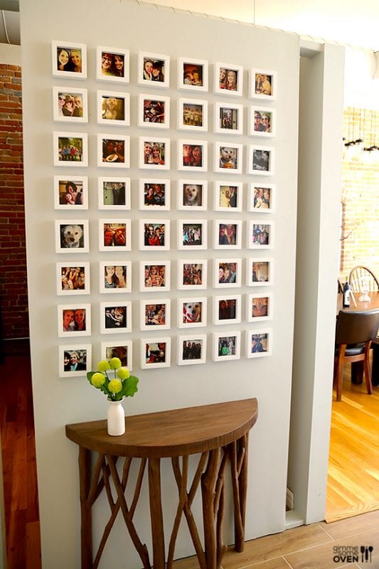Instagram frame wall -- super cool half-circle branch console table, too! Gimme Some Oven