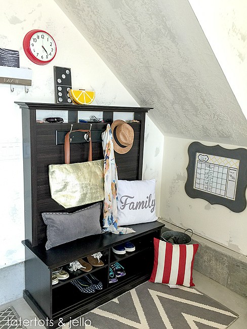 entertainment center turned into a hall tree for the mudroom, shoe storage and hooks and everything. Brilliant! | 100+ Beautiful Mudrooms and Entryways at Remodelaholic.com