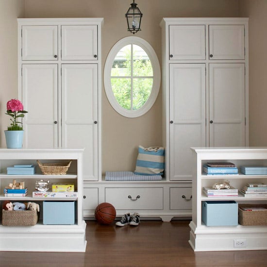 Lots of storage in a mudroom alcove, separated a bit by a knee wall or half wall with storage | 100+ Beautiful Mudrooms and Entryways at Remodelaholic.com