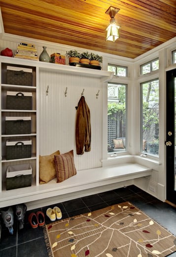 Mudroom Basket Storage, floating bench with cubbies and a shelf and hooks -- everything we need in the entryway! | 100+ Beautiful Mudrooms and Entryways at Remodelaholic.com