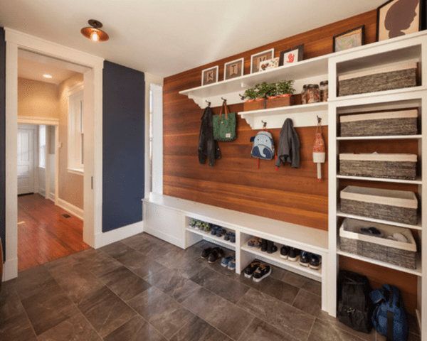 Contemporary mudroom, love the combo of the dark blue with the wood and all the shelves for storage and shoes | 100+ Beautiful Mudrooms and Entryways at Remodelaholic.com