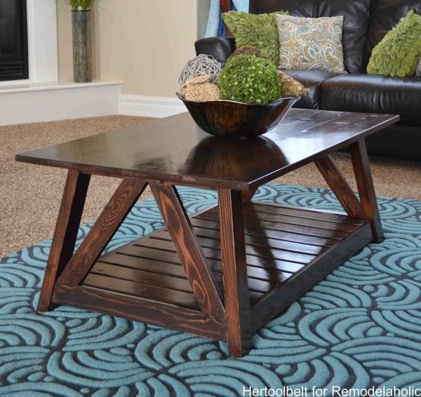 Inspired by a coffee table in a HGTV dream home. I love the trapezoid base and slats that make up this table. DIY slat coffee table with free plans.