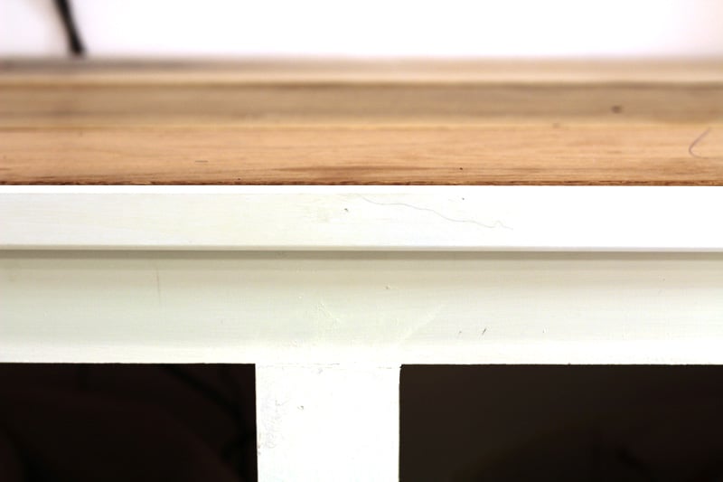 Trim on Top Piece of Bench Seat for media wall featured on Remodelaholic.com