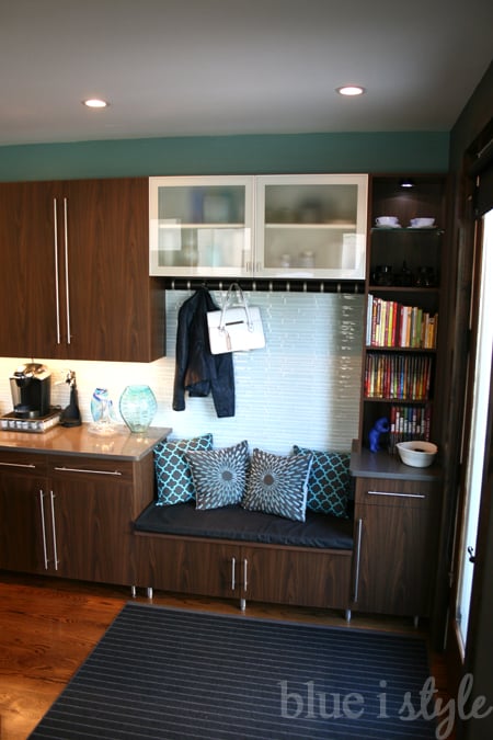 Turn a little corner of the kitchen into a mudroom, complete with a bench. Smart! | 100+ Beautiful Mudrooms and Entryways at Remodelaholic.com