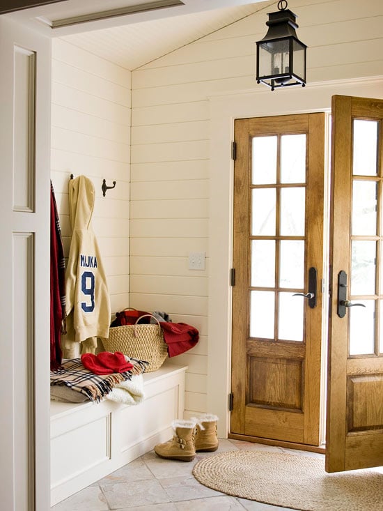 Neutral foyer, shiplap, bench, and wood doors. Can it get any better? | 100+ Beautiful Mudrooms and Entryways at Remodelaholic.com