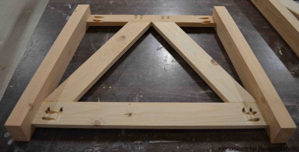 Inspired by a coffee table in a HGTV dream home. I love the trapezoid base and slats that make up this table. DIY slat coffee table with free plans.