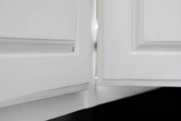 Wood to white kitchen without removing doors by Vanessa's Modern Vintage Home featured on @Remodelaholic