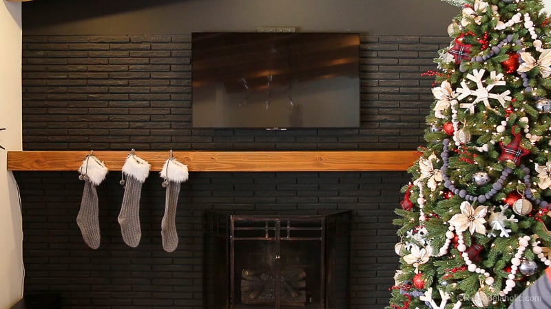 Looking to decorate your mantel for Christmas, but aren't sure where to start? Try these tips for creating a whimsical and rustic Christmas Mantel featured on Remodelaholic.com