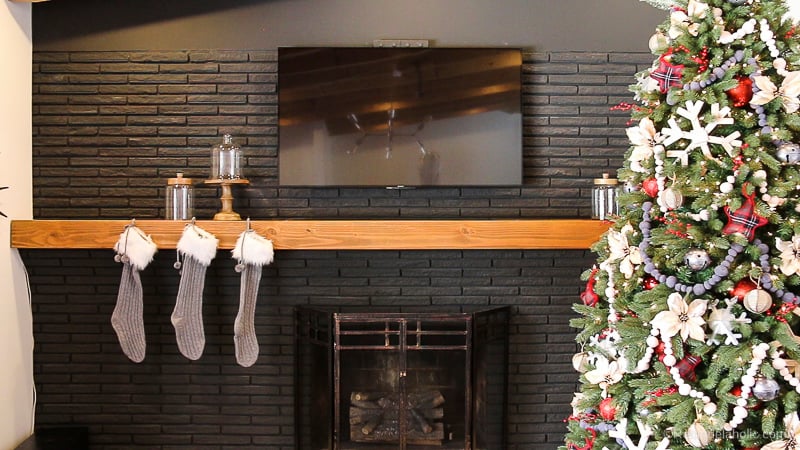 Looking to decorate your mantel for Christmas, but aren't sure where to start? Try these tips for creating a whimsical and rustic Christmas Mantel featured on Remodelaholic.com