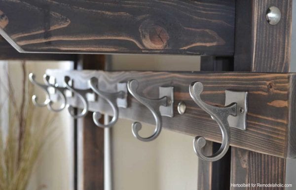 Building extra storage for your coats is easy with this free plan for a DIY hall tree coat rack. 