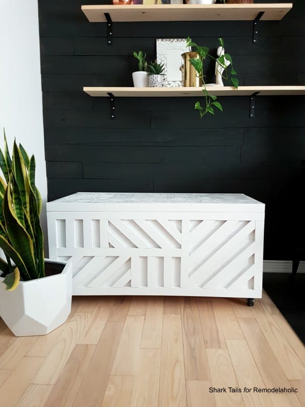 This plywood storage box is easy to build from just ONE sheet of 3/4" plywood and it's perfect for storing firewood for a woodburning stove, board games, blankets and pillows, or holiday decorations. The added geometric inlay pattern takes it from functional to fabulous and makes it a conversation piece for your living room! Use this as a coffee table or ottoman, or as a bench for added seating.