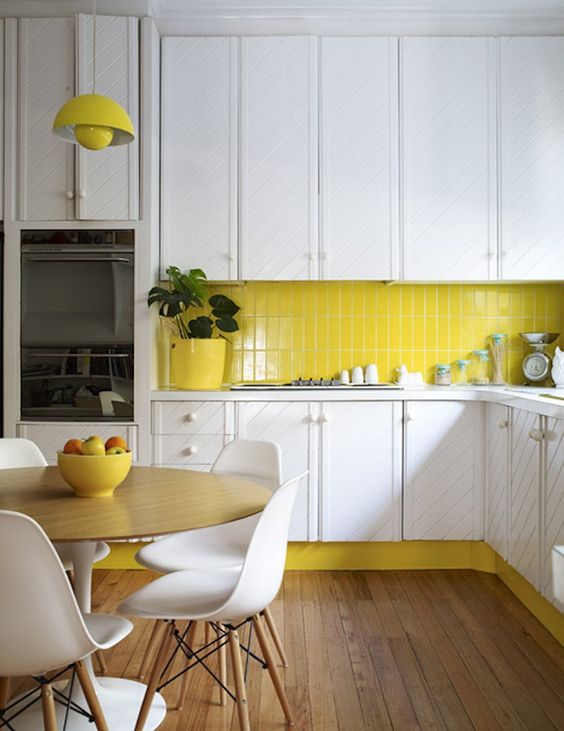 Sunny yellow kitchen backsplash and kickplate with white cabinets | Yellow Kitchen Inspiration #Remodelaholic