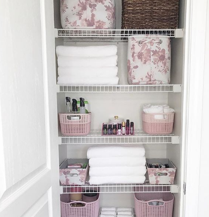 Linen Closet Organization with coordinating colorful baskets