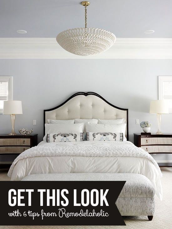 Grey Bedroom With White Trim And White Upholstered Bed With White Bedding