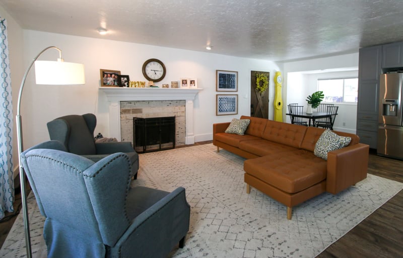 open concept floorplan living room before DIY fireplace makeover
