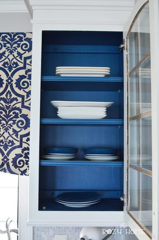 Kitchen Cabinets With Glass Door And Painted Blue On The Inside