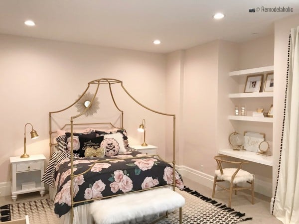 Metal four poster bed with a pretty floral bedspread, UVPH 2018 Home 30 Shelby Homes, Gatehouse No. 1 Furniture & Design, Photo by Remodelaholic