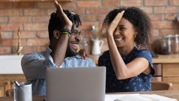 Happy Couple Checking Laptop