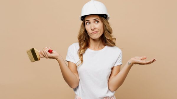 Woman Holds Paintbrush