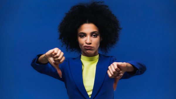 Woman Thumbs Down Two